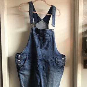 Distressed denim overalls